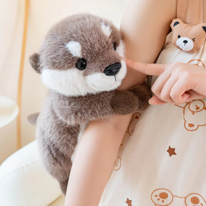 Peluche loutre mains magnétique