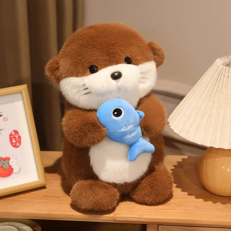 Peluche loutre poisson