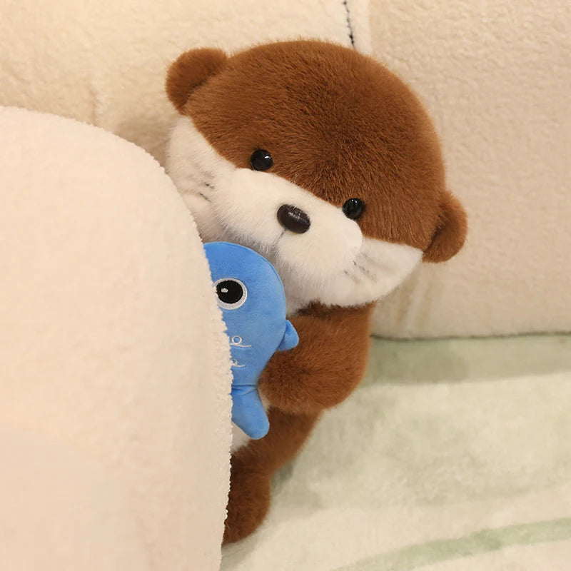 Peluche loutre poisson
